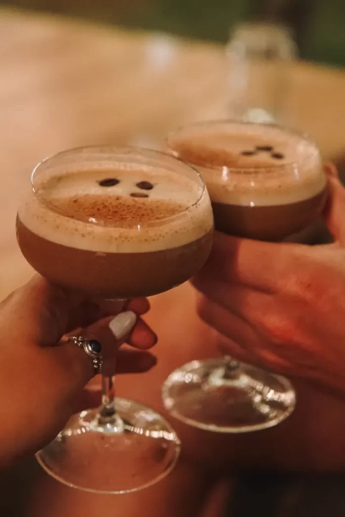 Two people cheers two Espresso Martinis at Salty Swamis in Arugam Bay