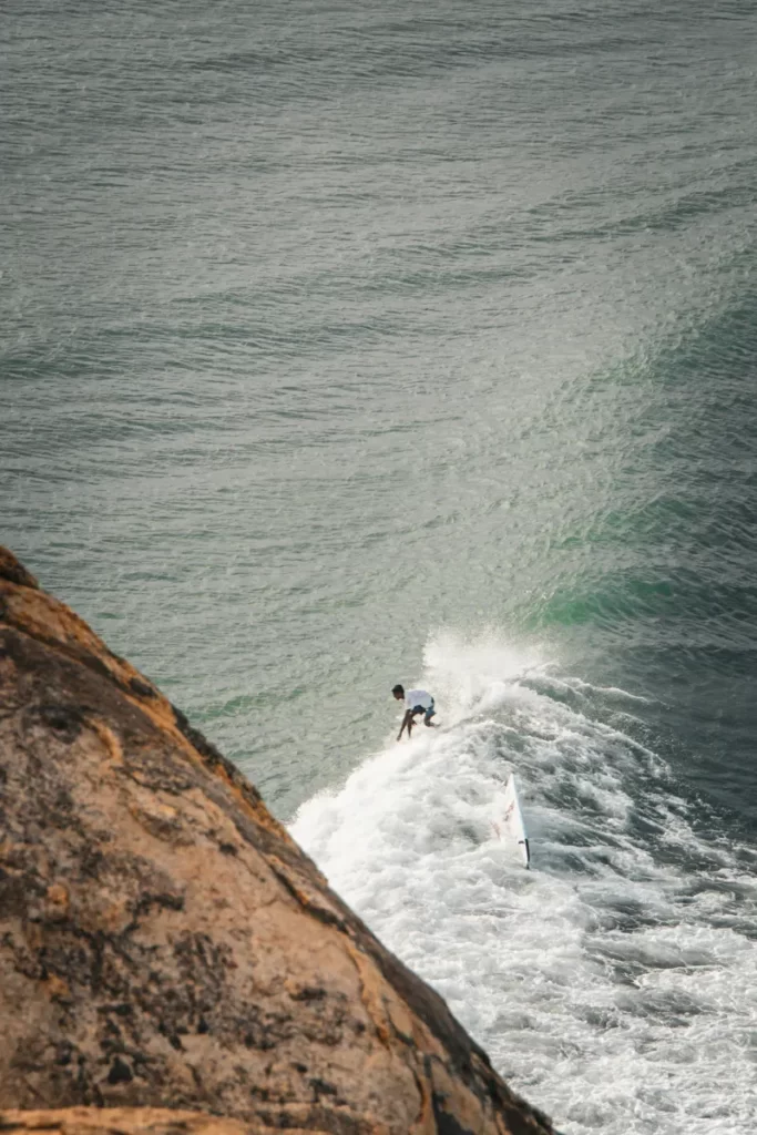 A Sri Lanka teenager surfing a wave shot from the top of Elephant Rock