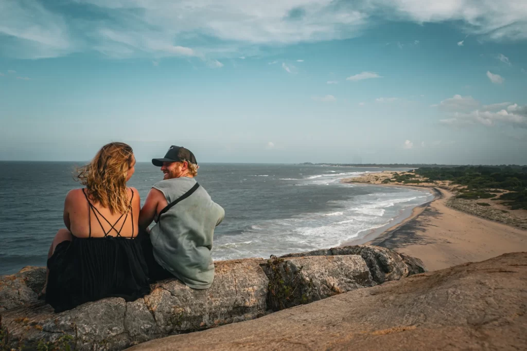 A couple smiles at each other from the top of Elephant Rock