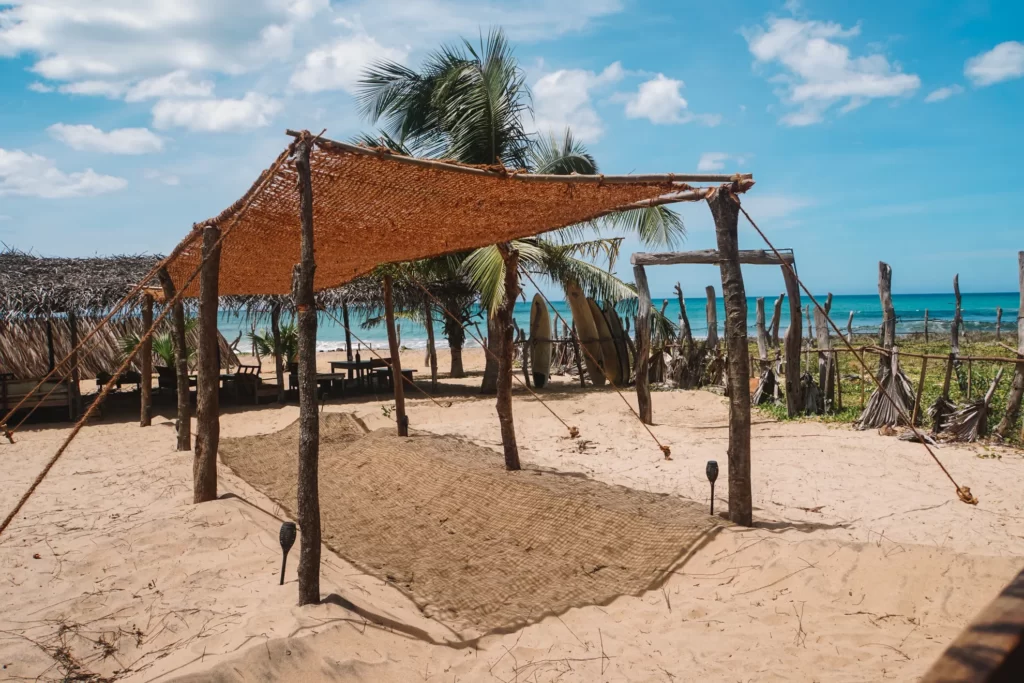 The makeshift shacks of Hilltop Cabanas overlooking the surf near Lighthouse Arugam Bay
