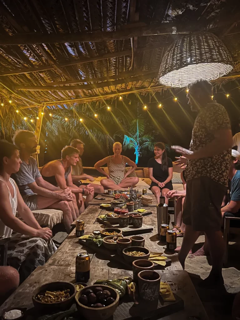 A group of surfers share a communal meal at Hilltop Cabanas restaurant