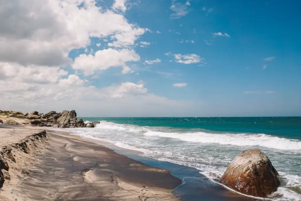 A deserted and black sand beach at Panama