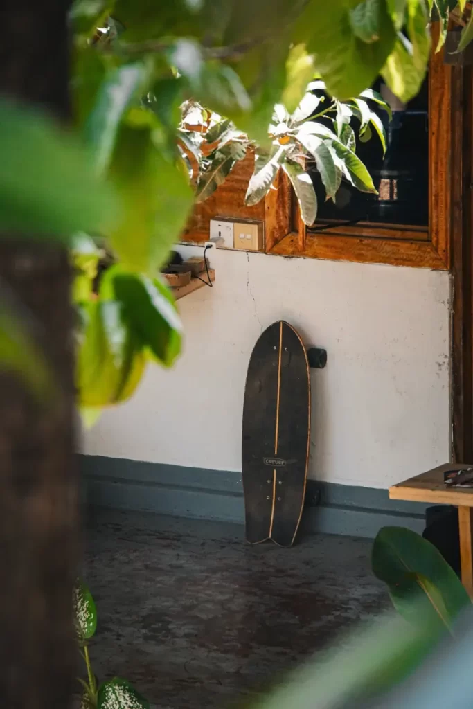 A skateboard is placed against a wall in Surf Gangs hotel in Arugam Bay