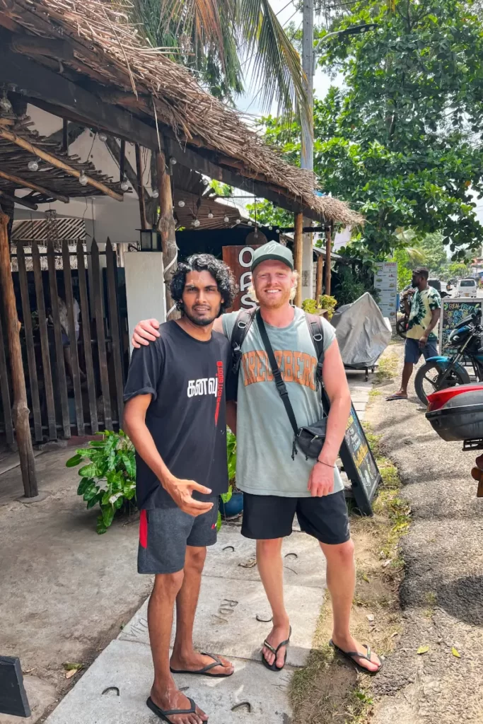 A digital nomad and a worker from Oasis Bay posing for a picture