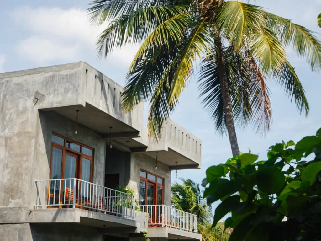 A view of the Surf Gangs accommodation with a palm tree