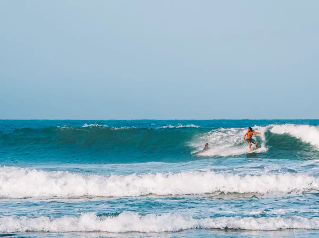 A surfer making a bottom turn at Main Point in Arugam Bay