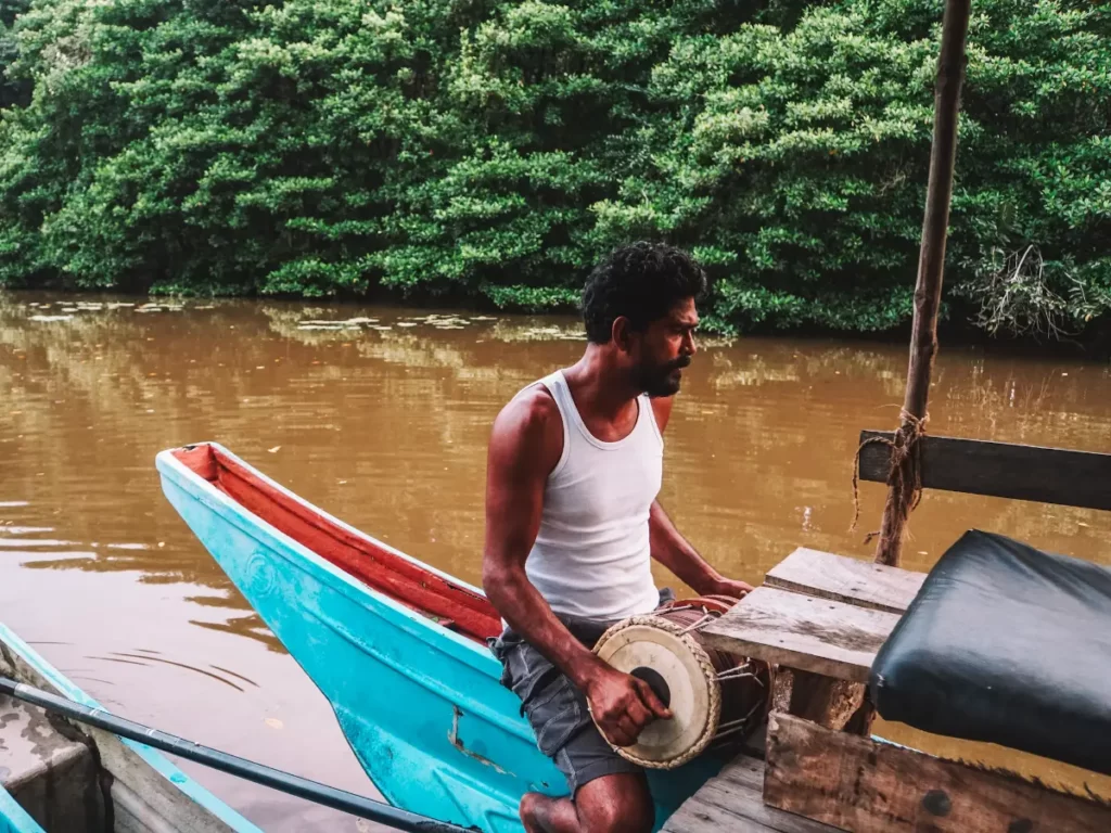Mowgli plays the drums on the river cruise to Ying Yang shack in Ahangama