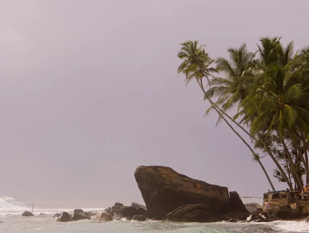 The frog rock at dusk on Dalawella Beach