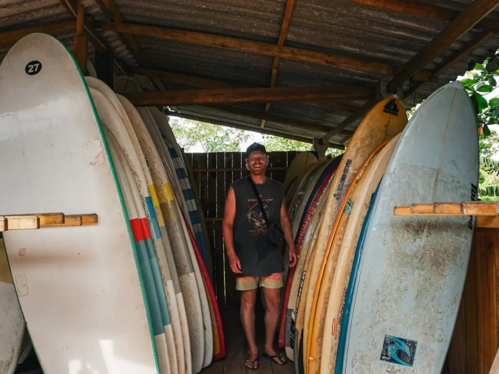 A tourist renting boards at Indika Surf Shop in Midigama