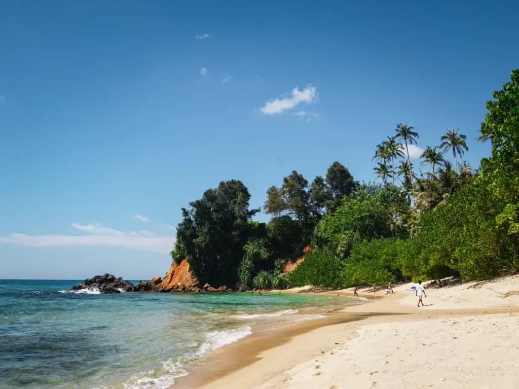 People swimming and playing at Secret Beach in Ahangama