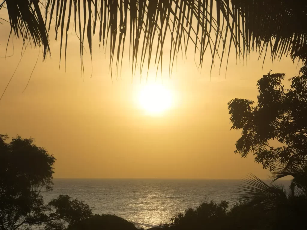 Sunrise over the Indian Ocean from the balcony of a stilted cabin at Hilltop Cabanas