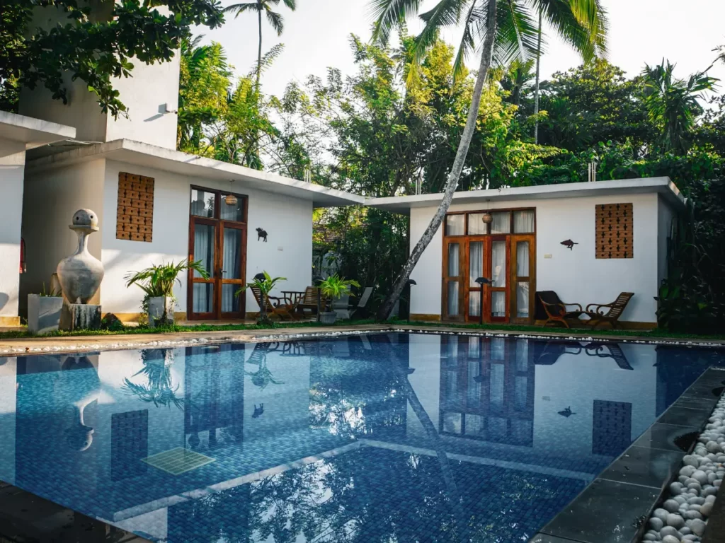 The pool and room at Venus Villa