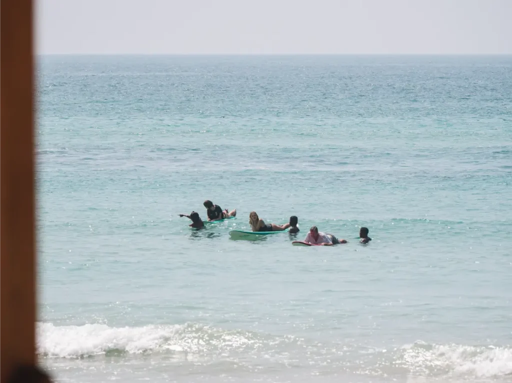 A group of beginners learning to surf at Ahangama Beach