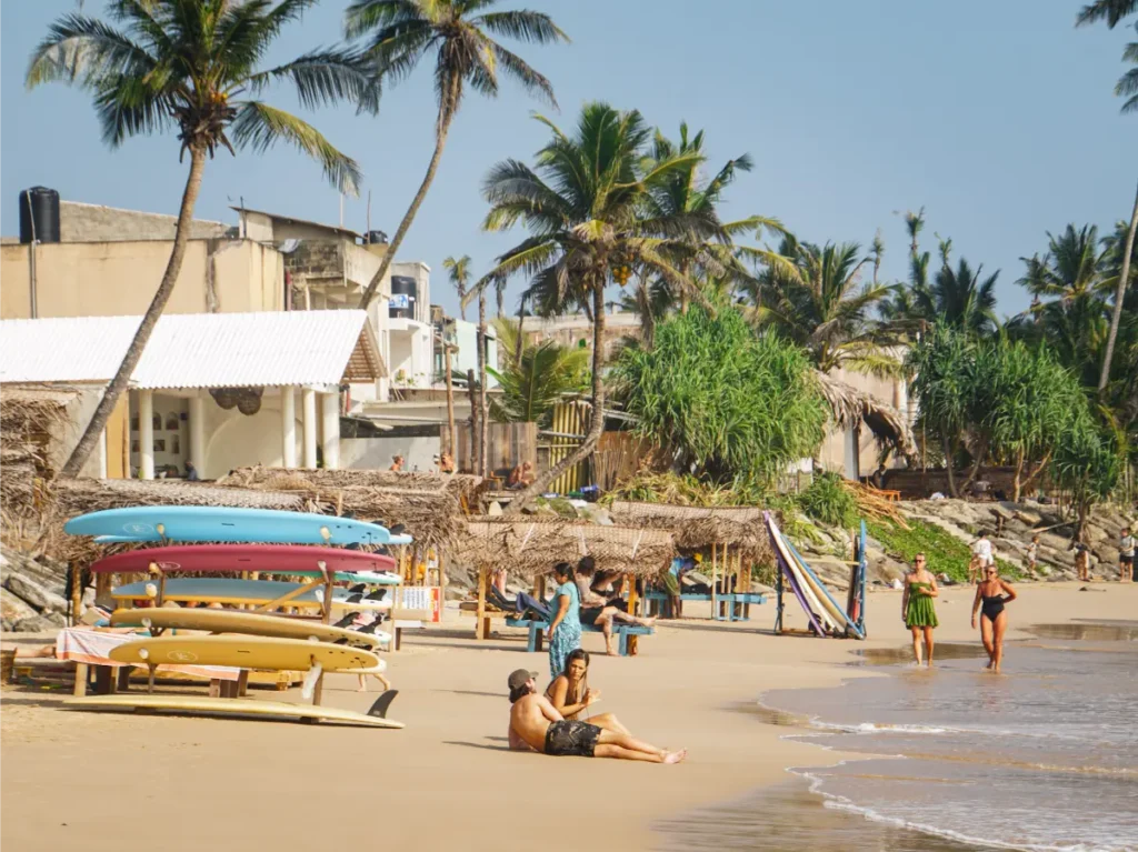 Tourist lying on the sand at Ahangama Beach