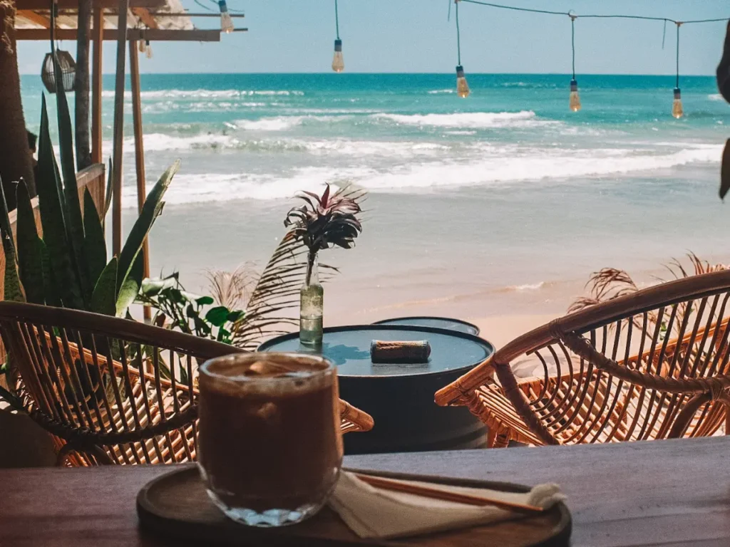 An iced coffee and ocean view at Carrie's, one the best restaurants in Ahangama 