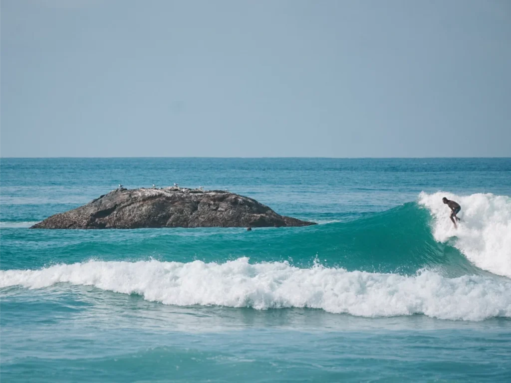 A local surfer hitting the right hander at The Rock Ahangama