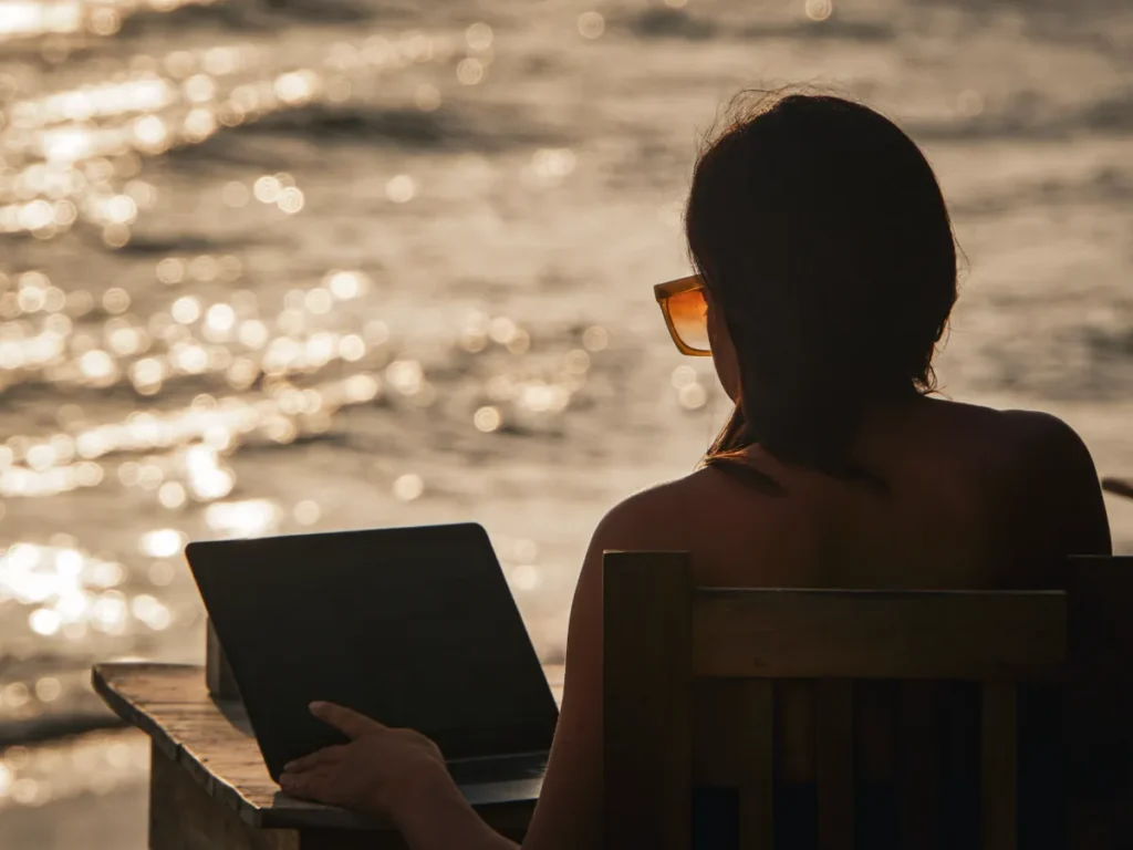 A digital nomad working on the beach in Ahangama