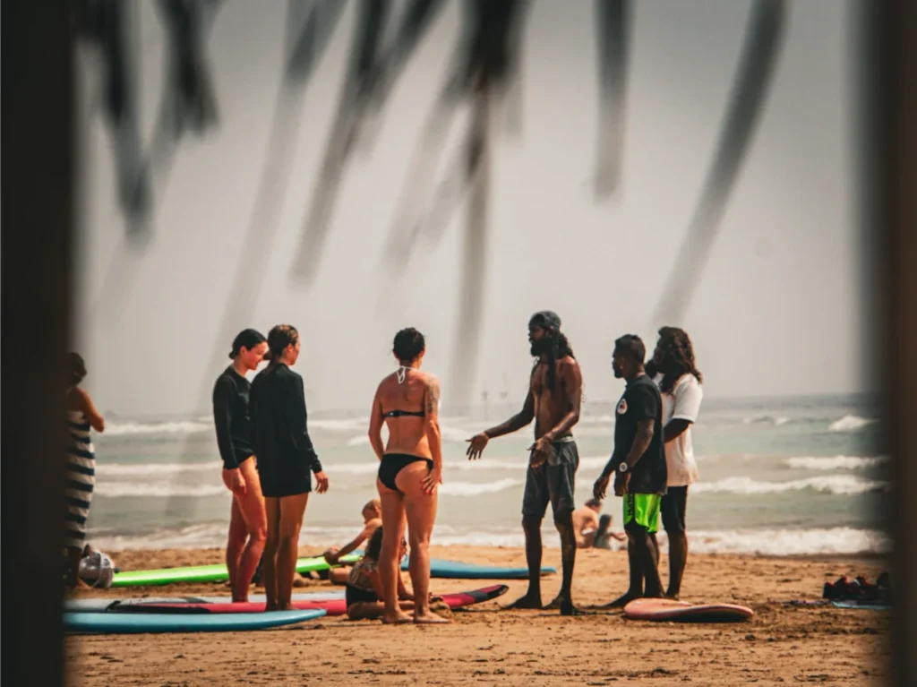 Beginners taking lessons at Kabalana Beach Break