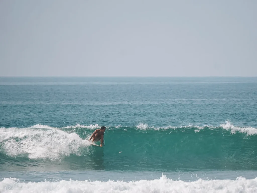 A longboarder riding a wave at South Beach