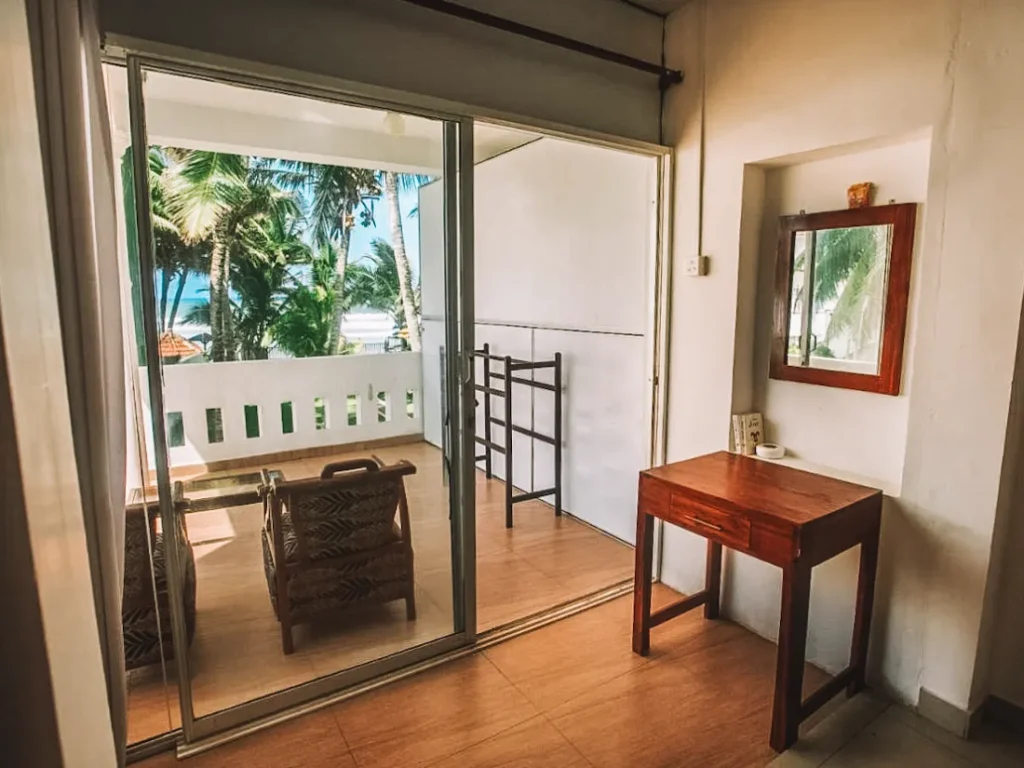 The rooms and balcony at Tharanga Surfing Villa