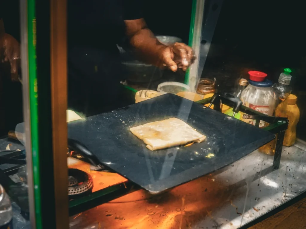 Local street food being prepared in Madiha