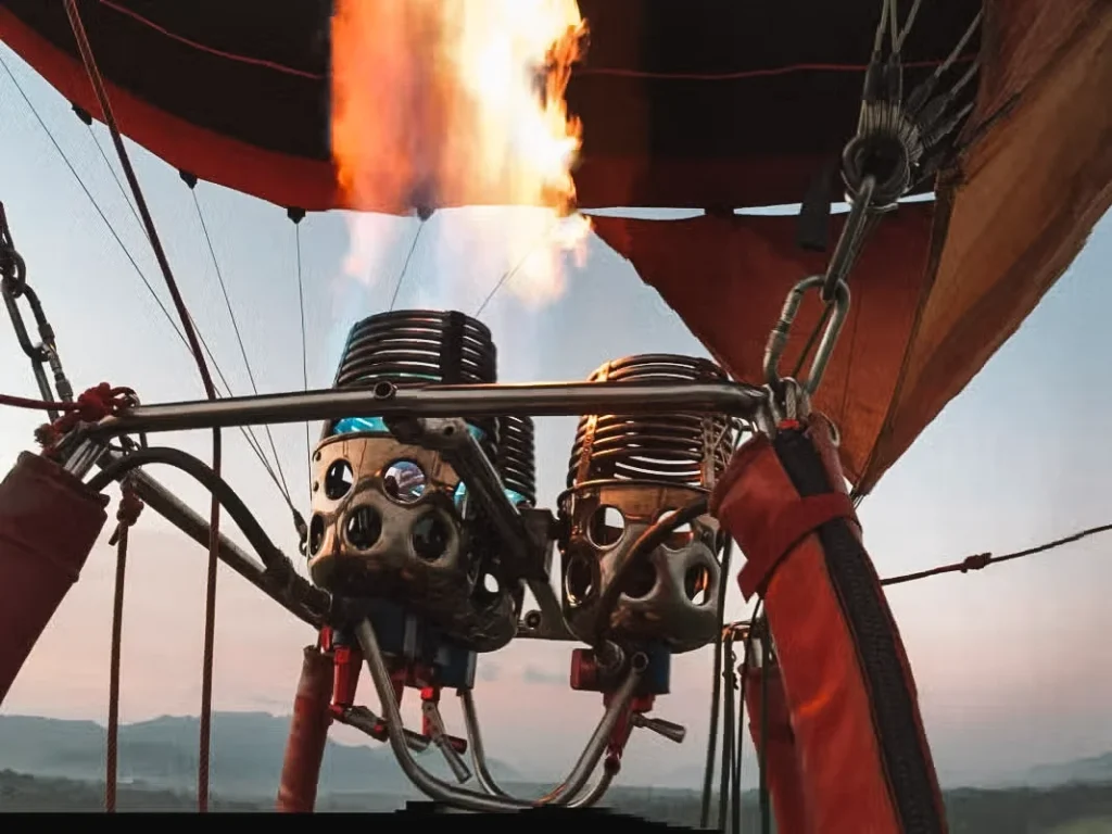 The flames shown up close lifting a hot air balloon above Sigiriya