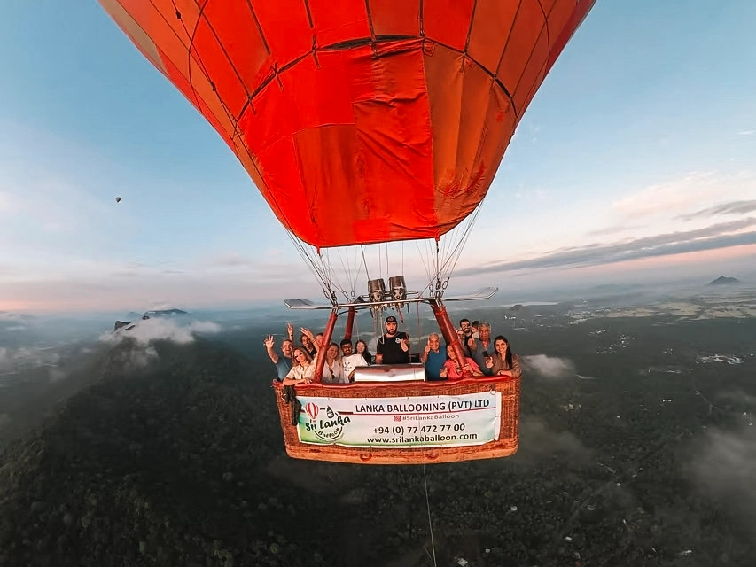A group takes a selfie on a hot air balloon ride above Sigiriya
