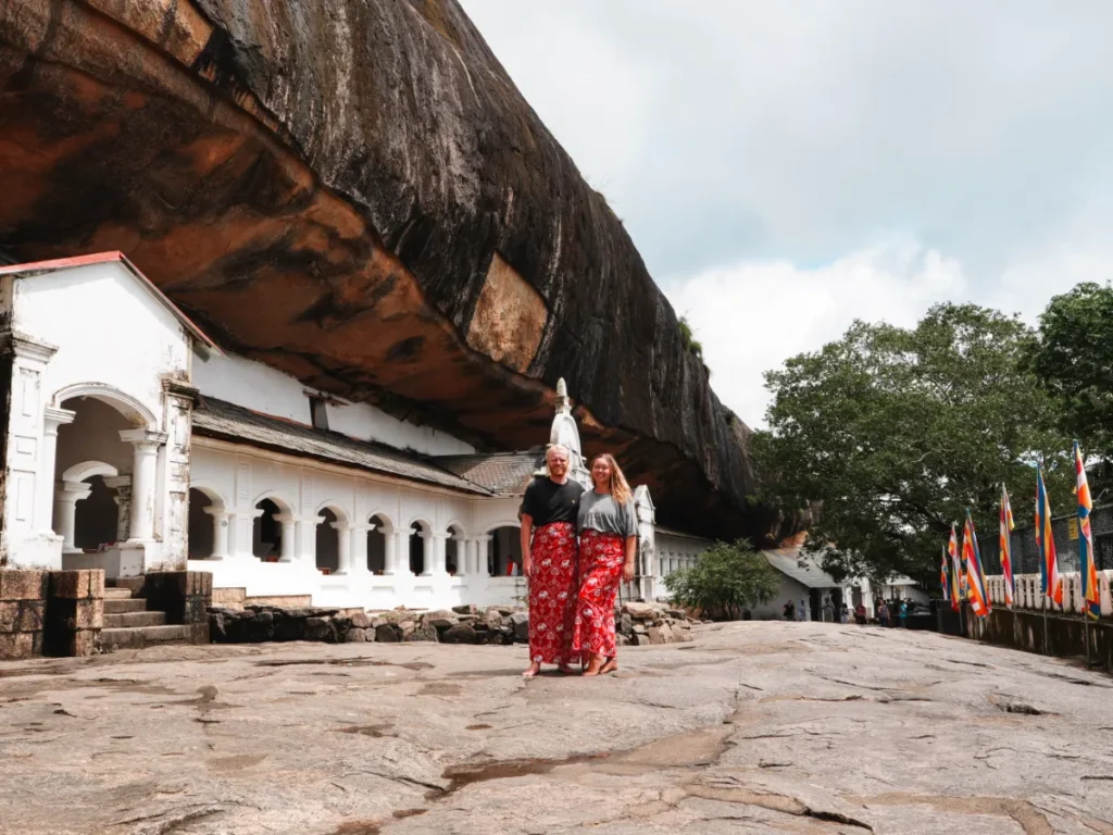 A couple wearing rented sarongs at the Dambulla Cave Temple