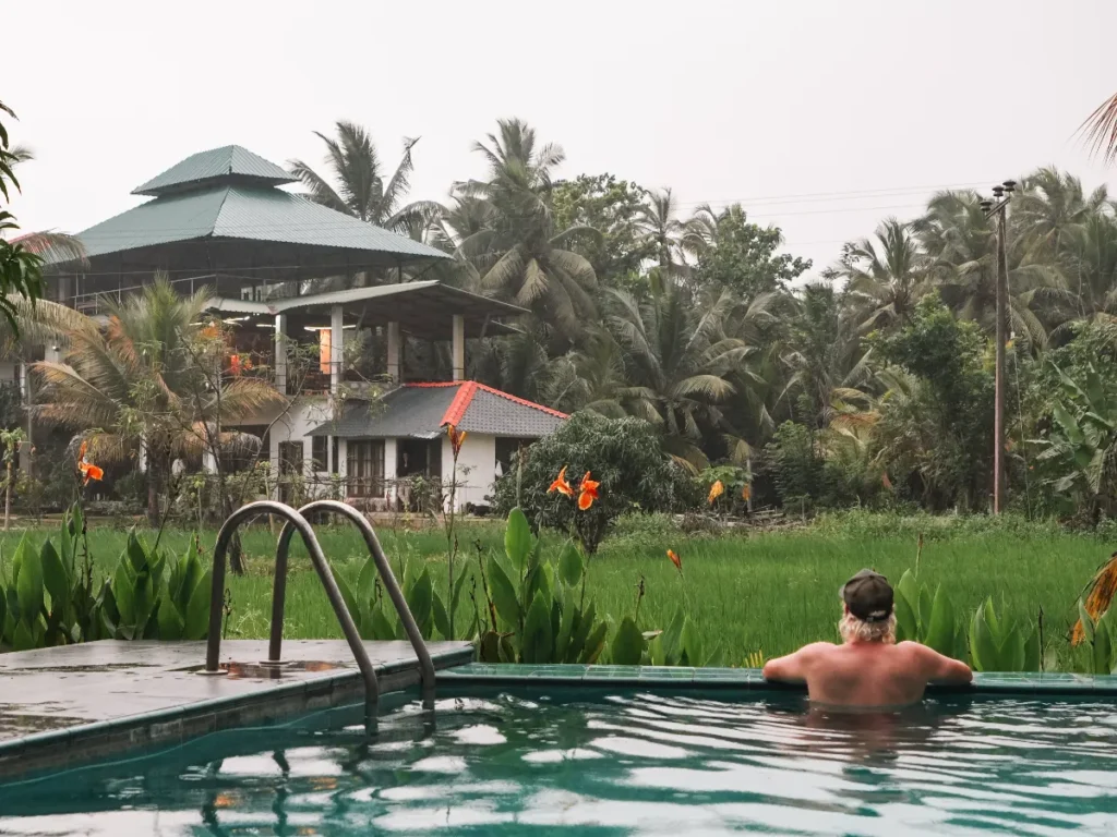 A man cooling off in the pool in Sigiriya