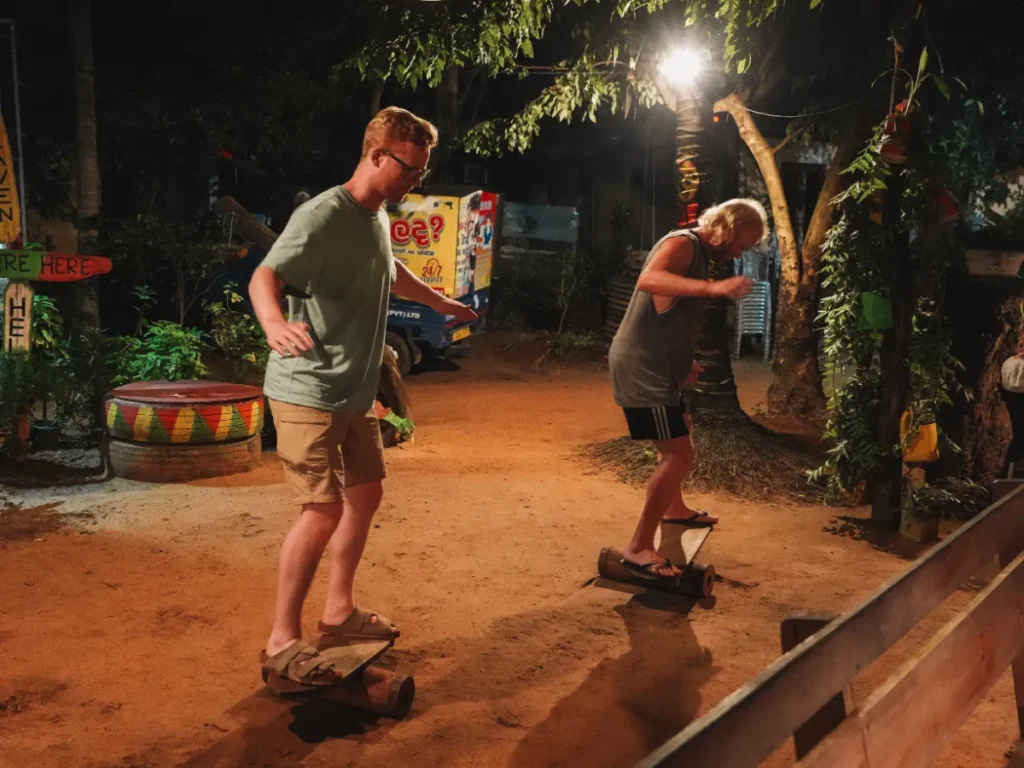 Two travellers compete on the balance boards at Rastarant in Sigiriya