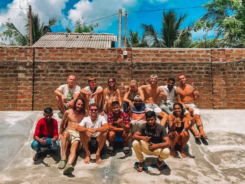 A group of travellers sit in the bowl at Hangten Surfskate hostel, a top budget hostel in Arugam Bay
