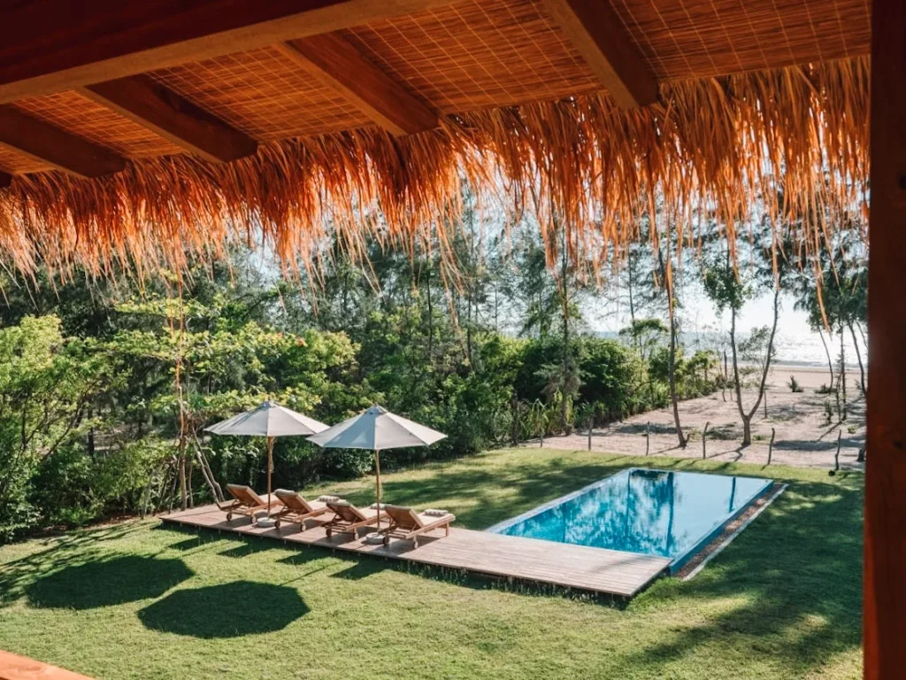 The pool and beach view at Niketh Villa Arugam Bay, a top luxury hotel