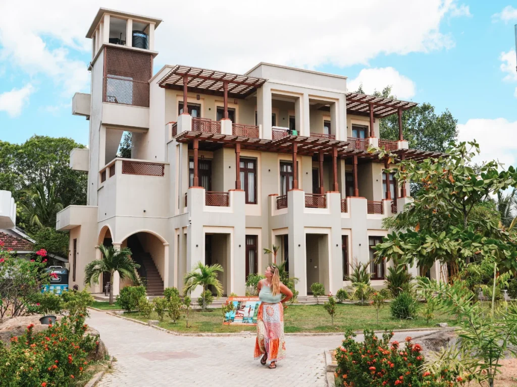 A girl stands in front of the property at Paddway Resort, a top place to stay