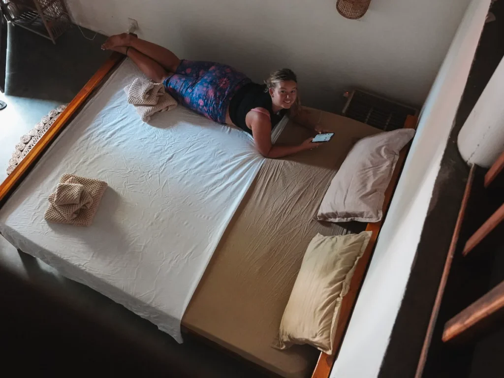 A girl lies on the bed in Pompon, a top budget hotel in Arugam Bay