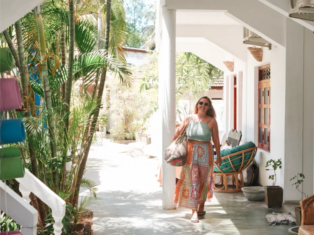 A girl walks through the hallway at Pompon in Arugam Bay
