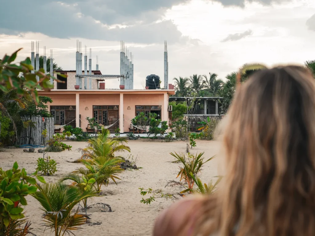 A girl looks at the rooms at Salty Alchemy Arugam Bay