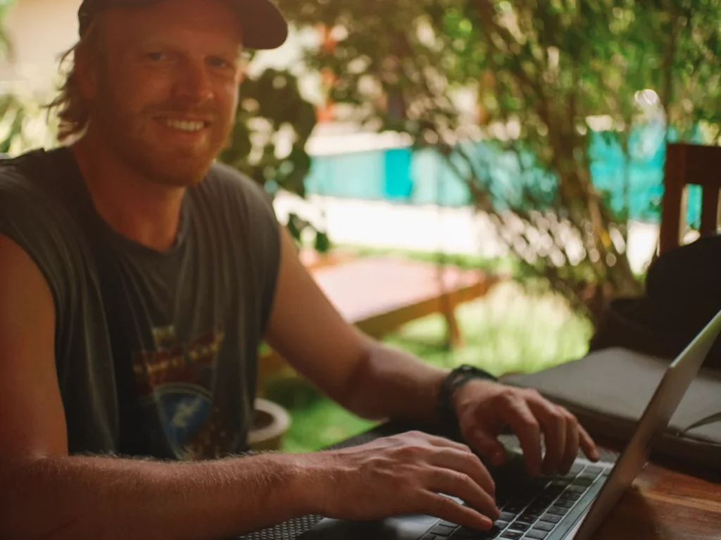 A digital nomad works by the pool at the Spice Trail in Arugam Bay