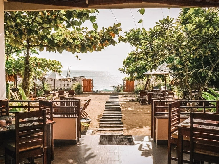 The garden and beachfront access at Bay Vista