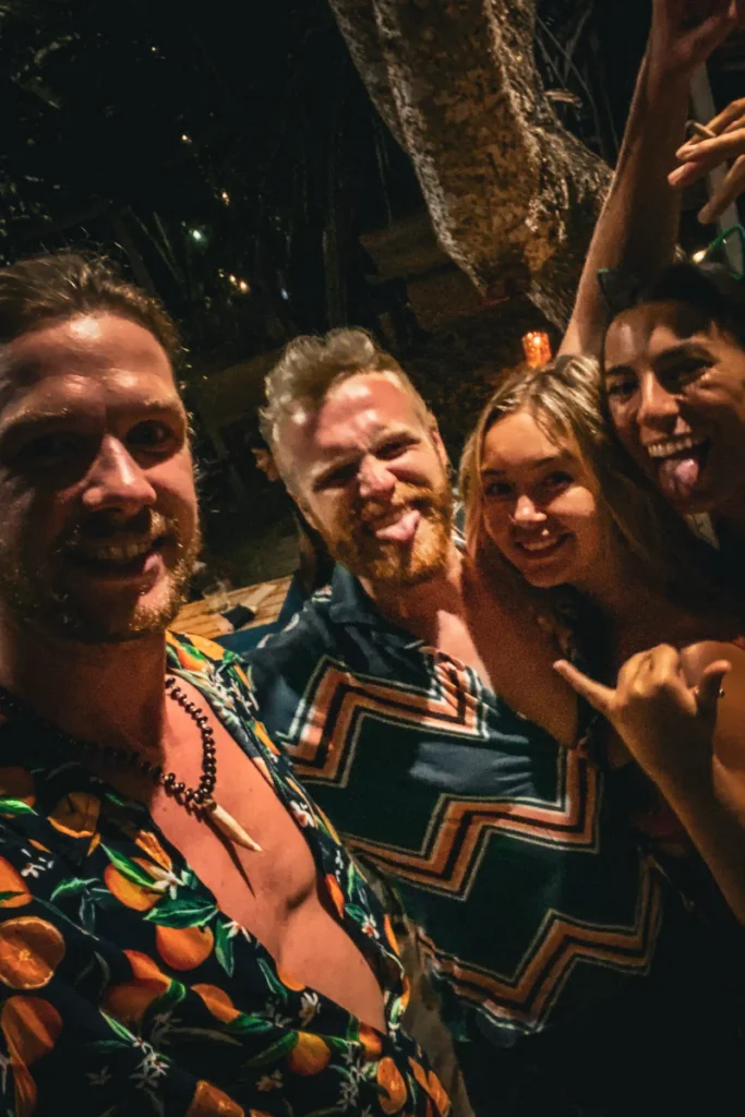 A group of travellers partying on the beach