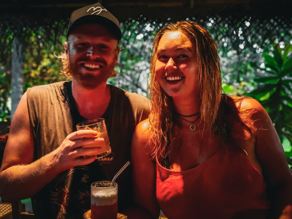 Couples in Hiriketiya enjoy cocktails at the beach