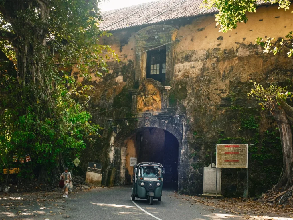 A tuk tuk drives through the tunnels in Galle Fort