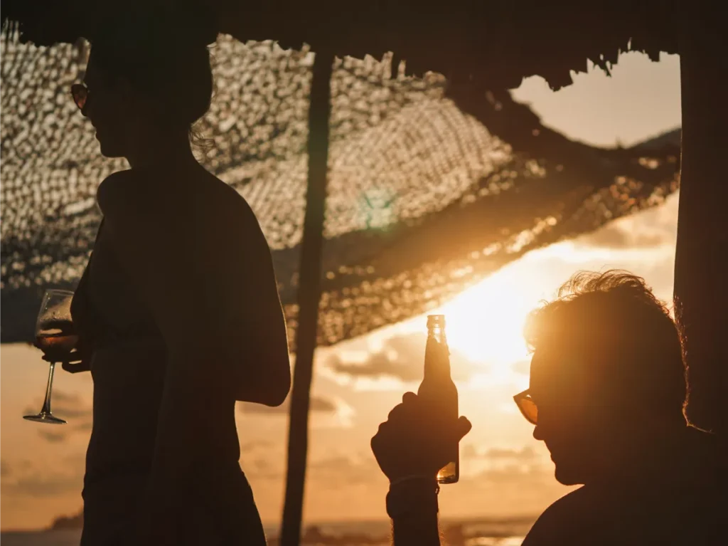 A man drinking sunset beers at Paradise Cove in Midigama